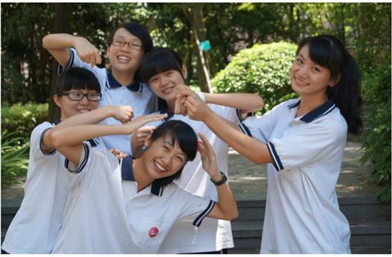 Junior Kathy Zhang (front center) poses with a group of her school mates in her hometown of Guangzhou, China.