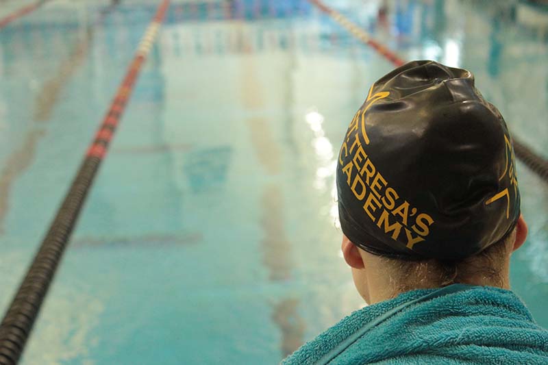Swim team breaks three school records at State