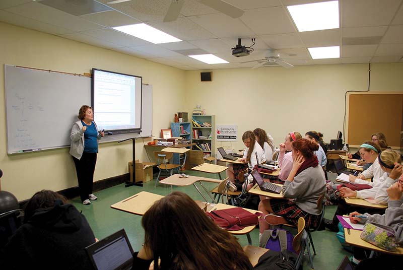 Theology teacher Betsy Hansbrough instructs a morality class about their end of the year presentations March 27.
