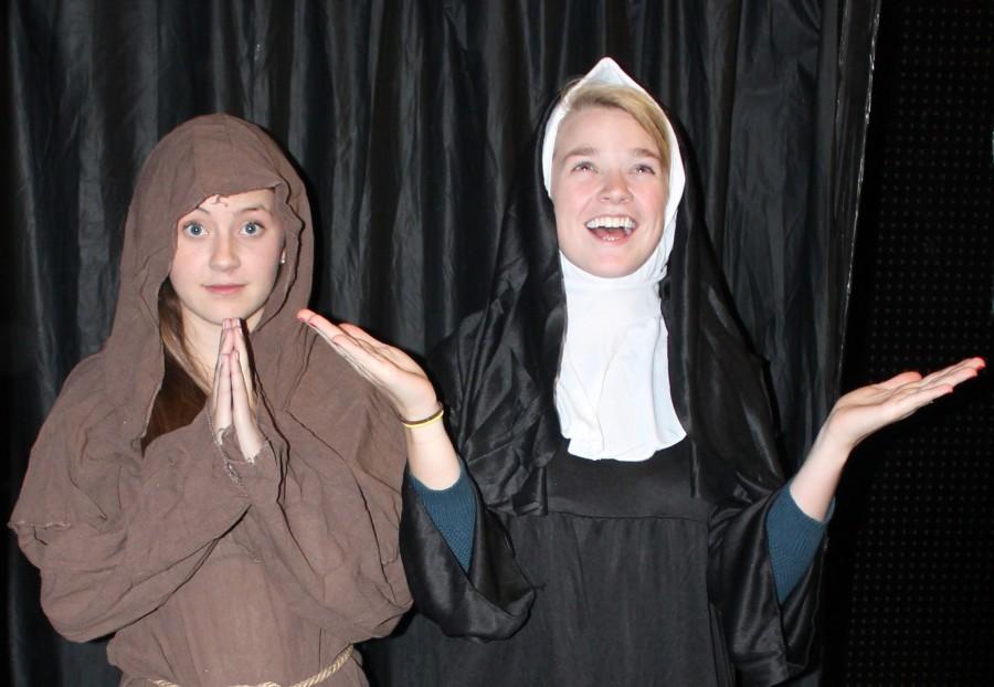 From left seniors Natalie Rall and Kelly Gardella are dressed up in a monk costume and a sister costume at Halloween City.