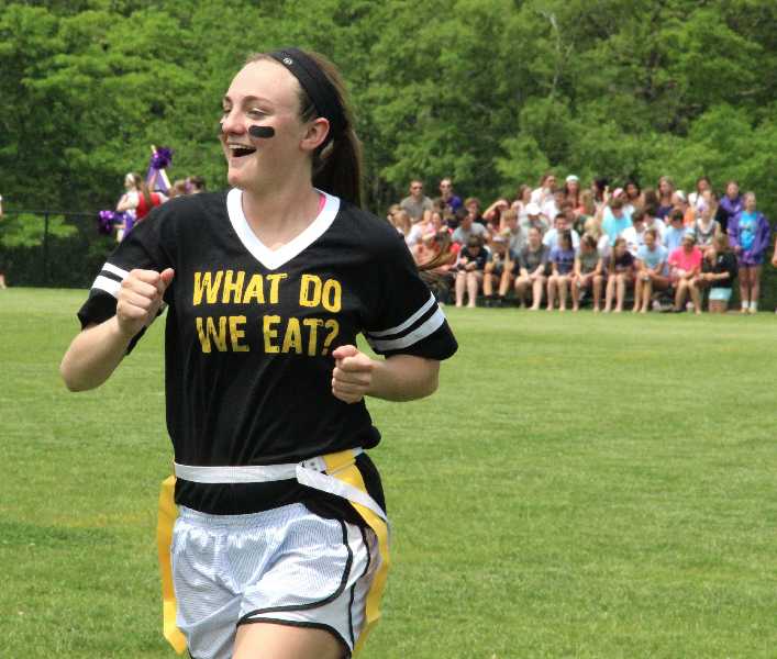 Becca Lueke does a celebration dance as she walks off the field during the senior powderpuff game against Notre Dame de Sion May 20, 2013. photo by Caroline Fiss