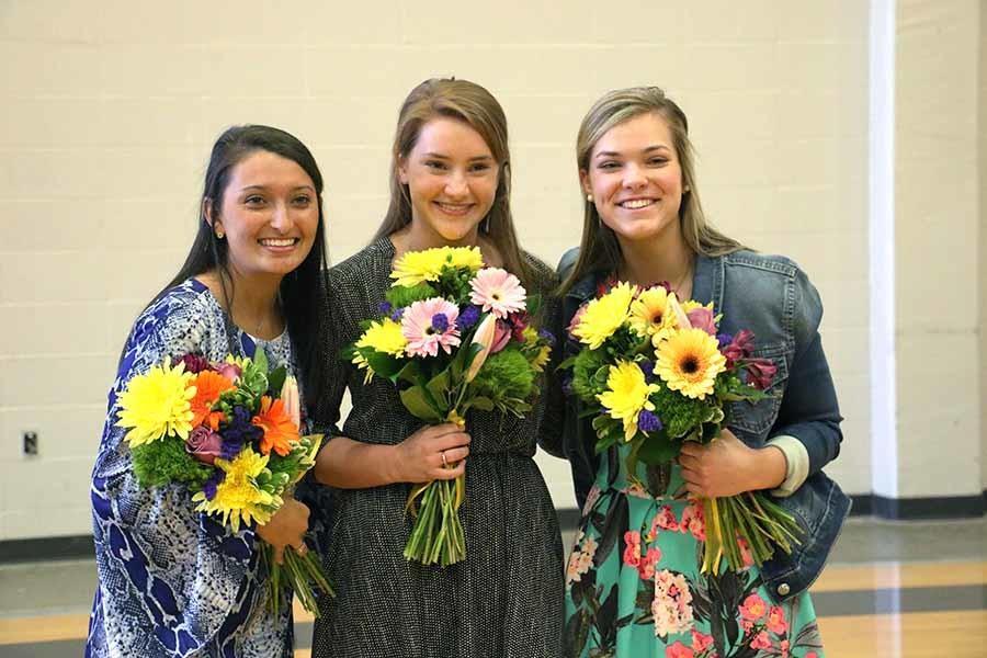 Seniors, from left, Caroline Strader, Ceci Ismert, and Anna Marie Fiorella pose together as the nominees for Academy Woman. 
