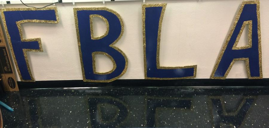 Blue+and+gold+letters+sit+in+Alicia+Stewarts+classroom.+FBLA+stands+for+Future+Business+Leaders+of+America.+photo+by+Paige+Powell