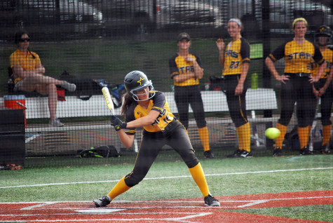 Freshman Lindsey Blaich swings at the ball at the home game against Benton High School Wednesday Sept 23. photo by Libby Hutchinson