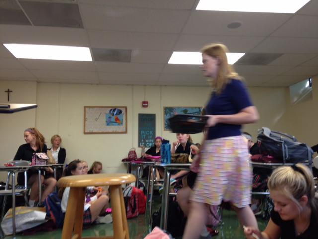 Kate Absher, English teacher and debate moderator, walks through her classroom during the info meeting for Debate team Aug. 31. photo by Audrey Carroll