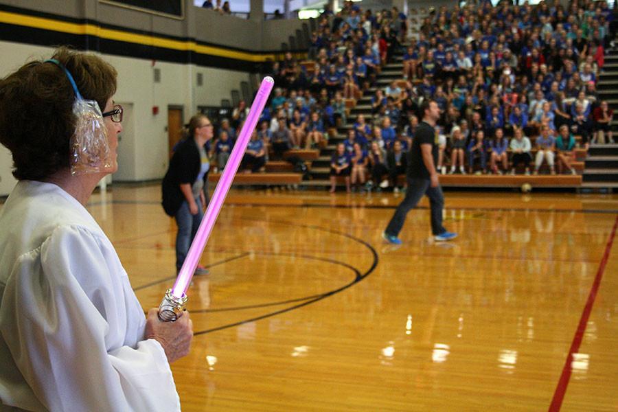 Kathleen Barry of the Donnelly team watches on at the annual building wars volleyball game. Both Donnelly and M&A teams were dressed in the theme of Star Wars. photo by Kate Scofield