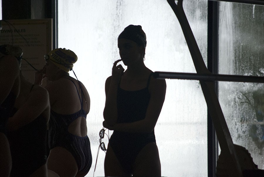 Darby+Pederson+stands+behind+the+block+Jan.+23+at+a+swim+meet+against+Blue+Spings+High+School.+photo+by+Libby+Hutchinson