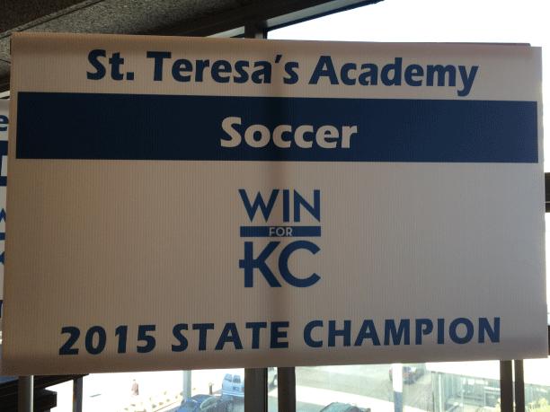 St.+Teresas+soccer+team+received+a+banner+to+hold+during+the+walk+of+champions.+photo+by+Katie+Donnellan
