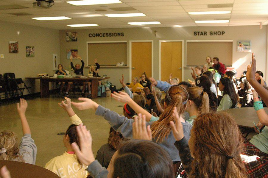 Students wave their hands back and forth at the CDC Karaoke event Friday Sept 30th. Multiple students got up and sung solos and duets at the event.