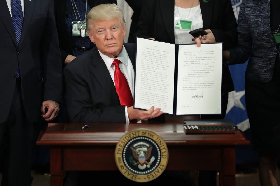 U.S. President Donald Trump displays one of the executive orders he signed during a visit to the Department of Homeland Security Jan. 25 in Washington, D.C. Trump signed executive orders related to domestic security and beginning the process of building a wall along the U.S.-Mexico border. photo courtesy of Tribune News Service