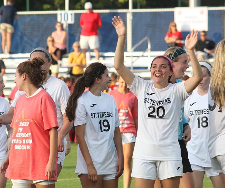 The STA soccer team celebrates their win after the State Semifinals at Swope Park on June 3. The team competed in the State Finals the next day. photo by Margaret Queen