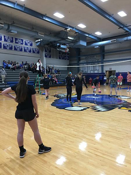 STA juniors wait for the volleyball to be served during a charity volleyball game at Rockhurst High School. The stars came in third place. photo courtesy of Megan Cotter 