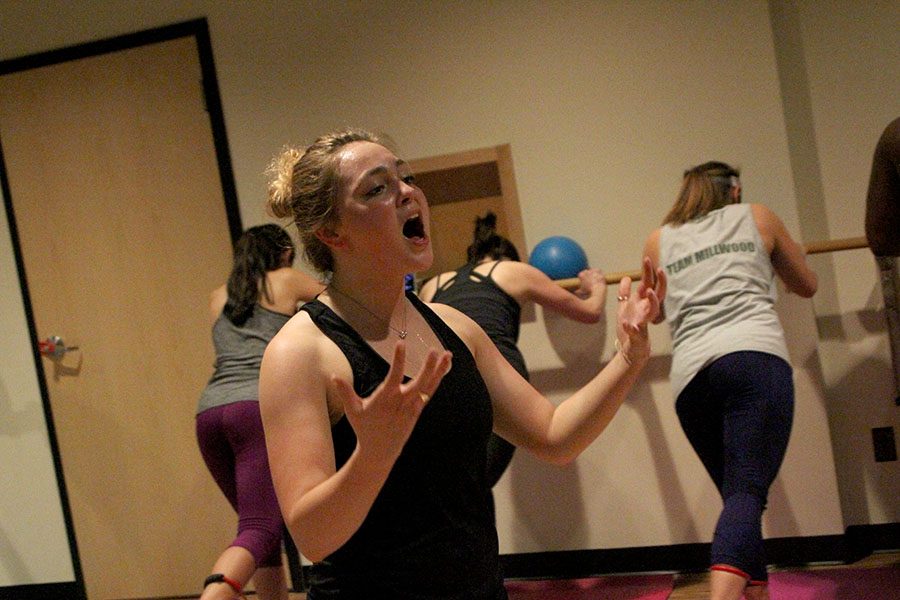 Senior Molly Burns instructs participants in her barre class Mar 2. Burns teaches lessons on Tuesdays and Thursdays during the week at Power Life Yoga. photo by Riley McNett