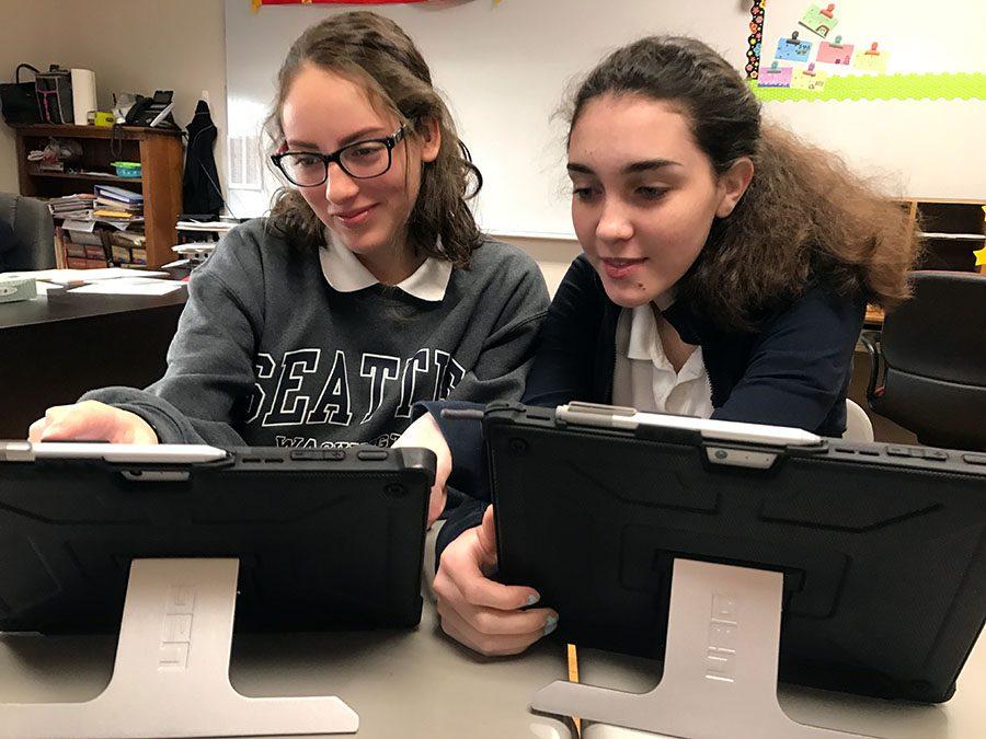 Sophomores Maggie Vasquez and Sasha Blair prepare before taking the National Spanish Exam. The test was administered on Mar. 23 and 24 during Spanish classes. photo by Hannah Jirousek