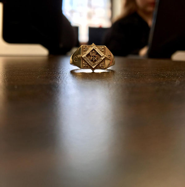 A class ring sits on a table in a classroom. Sophomores got their fingers sized for their class rings during class meetings April 6. photo by Anne Claire Tangen
