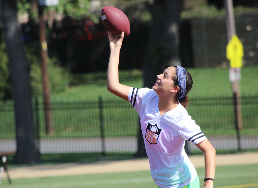 Senior Maura Knopke throws the football during Powder Puff practice at St. Teresas Academy May. 15. photo by Meghan Baker