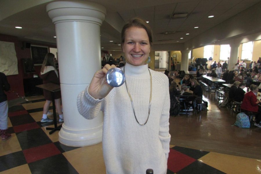 Director of campus ministry and service Amanda Essner displays her button featuring her Grandpa Prep. photo by Faith Andrews-ONeal