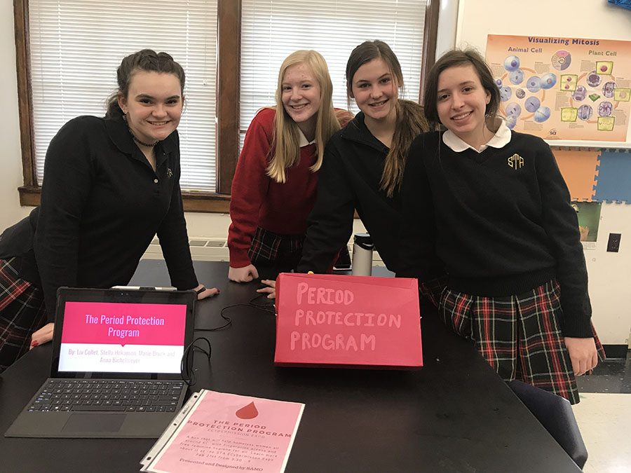 Freshmen Liv Collet, from left, Stella Hokanson, Marie Bruck and Anna Bichelmeyer, were in a group called SAMO. They conducted a project that created a thumbprint activated machine that distributes feminine hygiene products to give more women access to the necessity. photo by Trang Nguyen