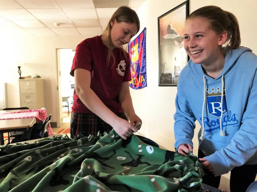 Junior Holy Phalen and senior Megan Warnecke worked together on a blanket during activity Feb. 2. Rotary is an extracurricular dedicated to service. photo by Gabrielle Pesek
