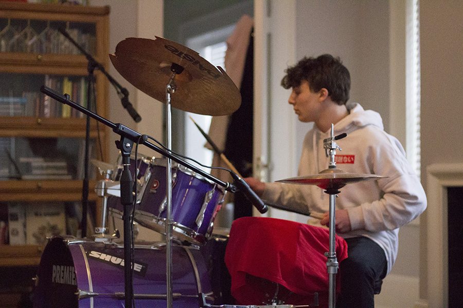Rockhurst junior Gabriel Vianello plays the drums in his room Feb. 6. Vianello has been playing the drums since he was in third grade. photo by Amy Schaffer