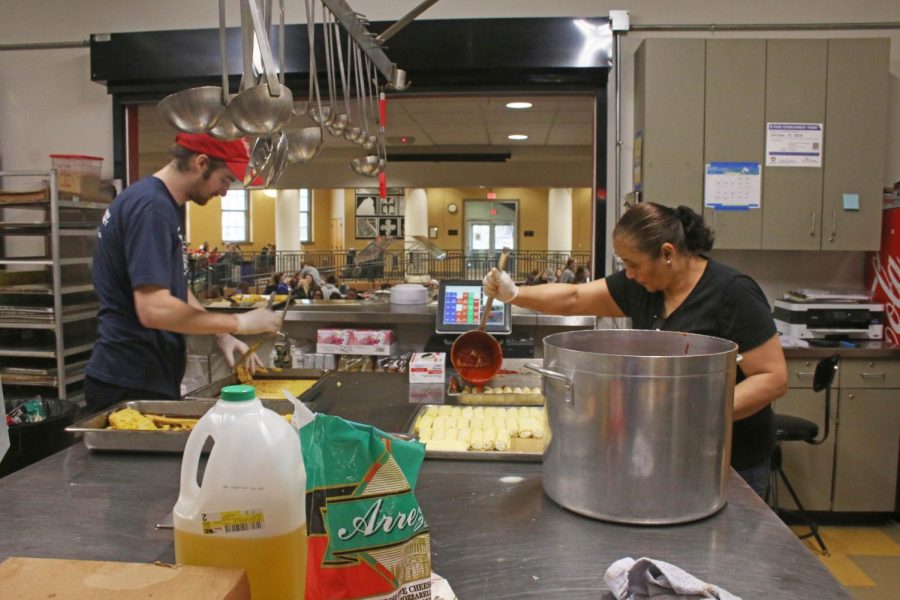 Chefs Jordan Smith and Laura Gonzales prepare lunch March 23. Smith has been working at STA for four years and this is Gonzales first year.