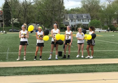 The teammates present their seniors with flowers and balloons. photo by Torri Henry.