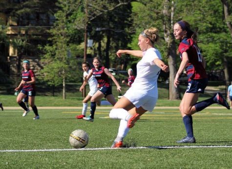 Lily Farkas prepares to kick the ball in the game against St. James Academy on May 9. Farkas scored three of the Stars goals. photo courtesy of Laura Cowan.