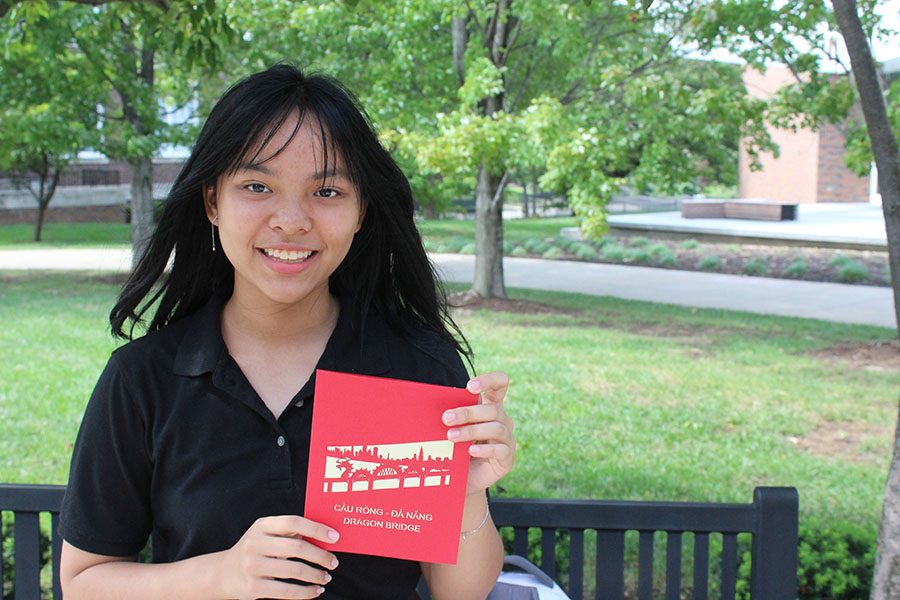 Freshmen Ha Truong poses with a card she bought in Vietnam before coming to Kansas City Aug 31. Truong arrived in the United States over the summer. photo by Maggie Hart