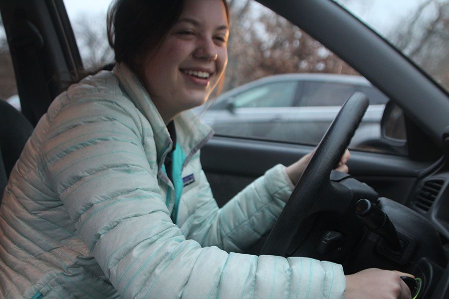Junior Ava Lee starts her car before leaving school Dec. 4. Lee’s car got t-boned last year on 55th Street, behind the STA track. “After my experience last year, if possible, my parents always drive me to school when there is ice on the roads,” Lee said. photo by Claudia Benge 


