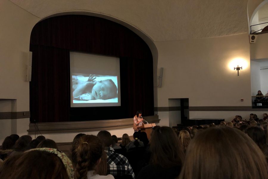 Melissa Ohden speaks to STA students and faculty against a backdrop of her as a baby Jan. 28. Ohden is a Catholic convert and speaks on her life experiences of following Gods plan and spreading her message. photo by Lily Hart