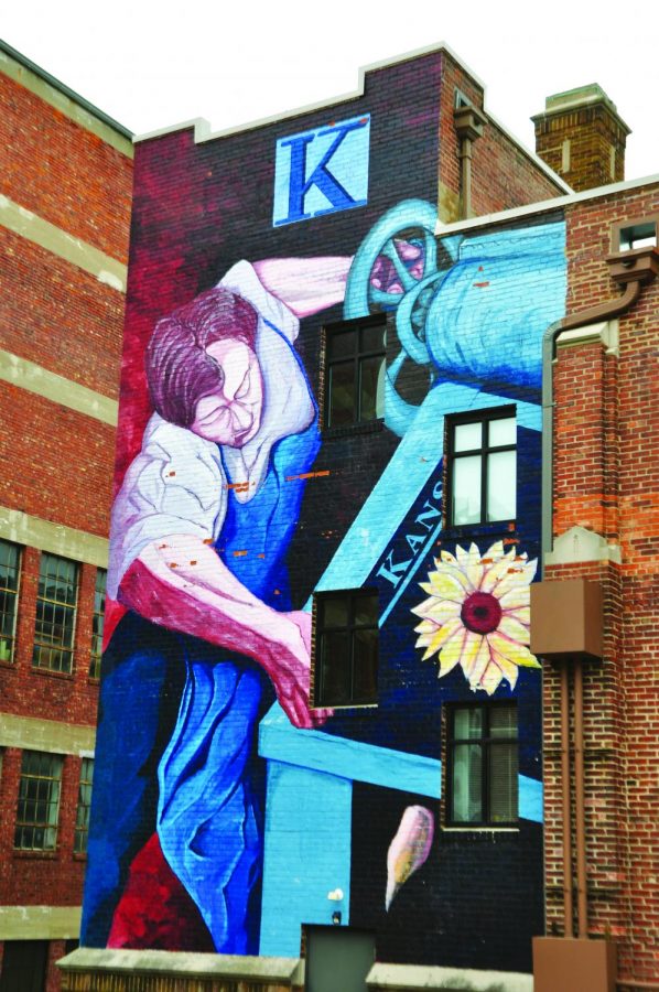 “The Kansan Printer” covers a wall on the building at 901 N. eighth street, which used to house the Kansas City Kansan newspaper nearly 80 years ago. The mural was commissioned in 2006 as part of the Downtown Kansas City, Kansas Avenue of Murals. photo by Gabby Staker
