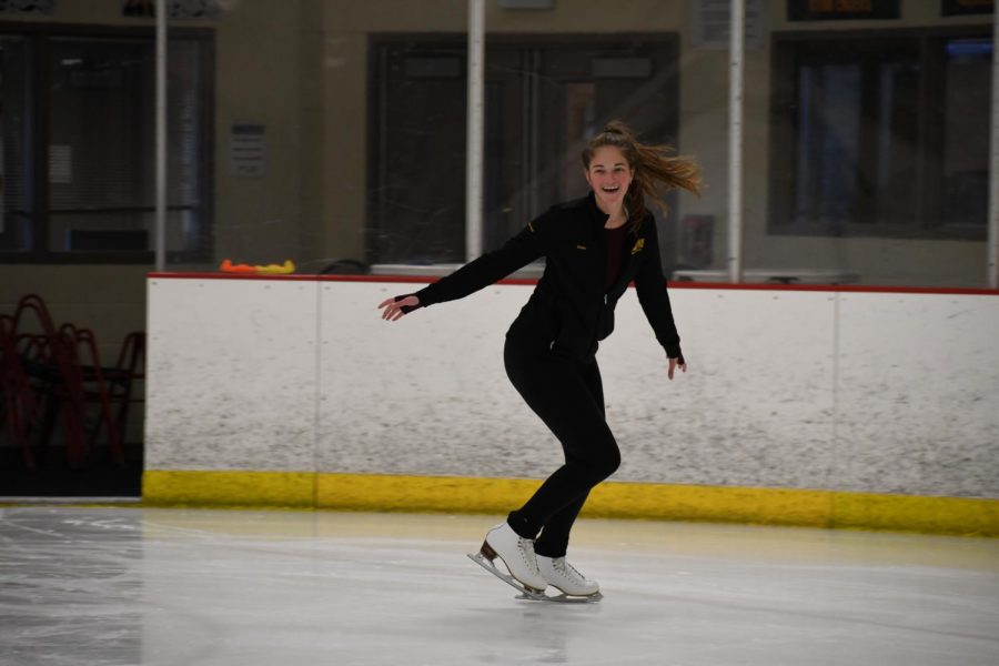 Senior Emma Marsh smiles during her skating practice Nov. 19. Marsh practices with friends and team members five days a week after school. photo by Claudia Benge 