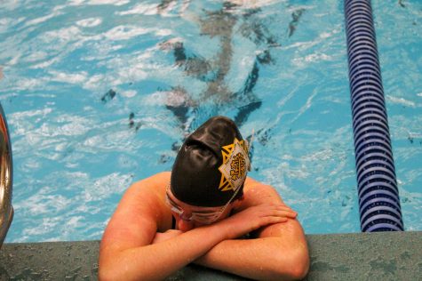 Senior Brooke Fallis catches her breath after her 50-meter freestyle race Jan. 25. Fallis realized she was iron deficient last year. photo by Katie Massman