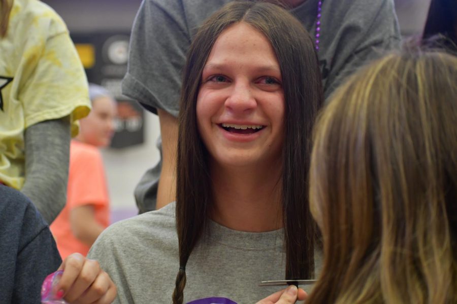 Grayson Walton becomes emotional when her hair was first cut Mar. 6.  Junior Georgia Winfield mentions how it would be an emotional and brave moment for all girls. photo by Becca Speier

