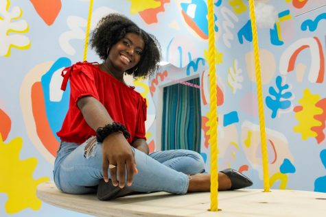Senior Faith Andrews-ONeal poses for one of her senior pictures at Wonder Wonder, a photography studio in Oak Park Mall Sept.28. Andrews-ONeal is motivated  to do great things in her school community because of how much support she has received these past years. photo courtesy of Amy Schaffer 
