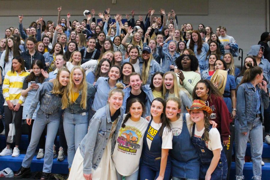 STA students cheer in the bleachers at the Rockhurst High School vs. STA volleyball game held at Rockhurst Feb. 24. The theme for the student section was denim. photo courtesy of Liv DeSantis