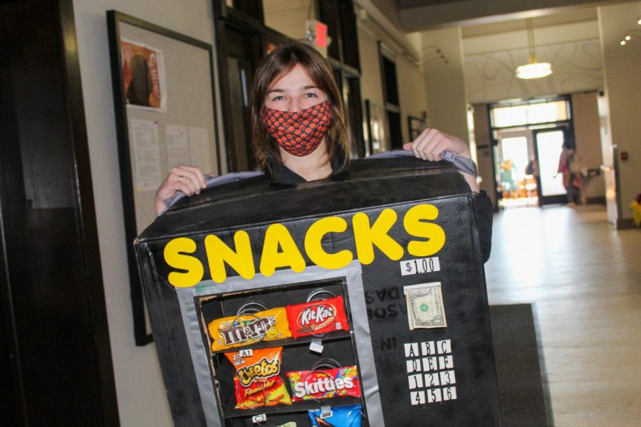 Junior Sophia Beshoner wears a vending machine costume Oct. 30. Beshoner created the costume out of household items, with the help of her mom. photo by Katie Massman