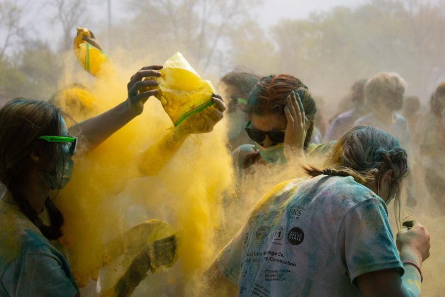  Yellow powder is thrown onto an unsuspecting group of friends April 26. The Color Throw is an annual tradition that happens near the end of the school year.