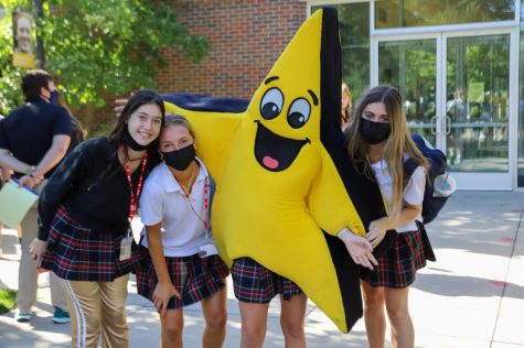 Juniors, from left, Bella Stockwood, Sarah Schloegel and Emma Mullins pose with Twinks. All three girls are members of Spirit Club. photo by Charlotte Malone