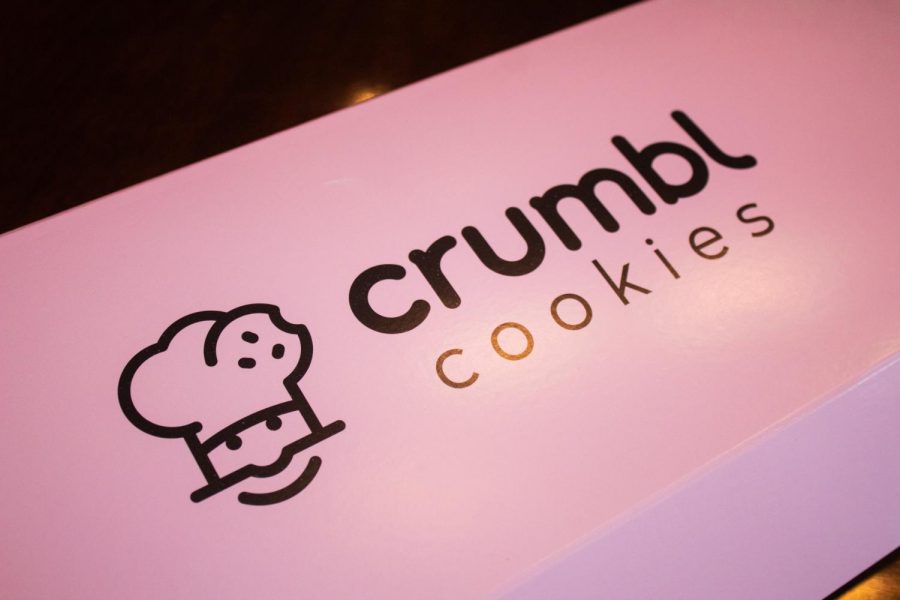The cookies from Crumbl come in this well-known pink box Aug. 30. Due to the cookies’ popularity on social media, people have labeled the box iconic. photo by Lily Sage
