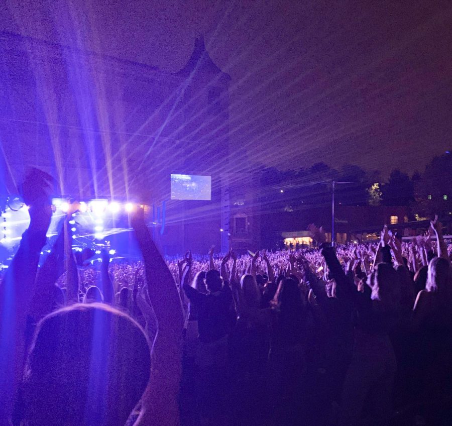 Thousands of people in the crowd put their hands up after being prompted to by Pitbull Oct. 6. Pitbull performed at Starlight Theater, an outdoor concert venue. photo by Lily Sage 