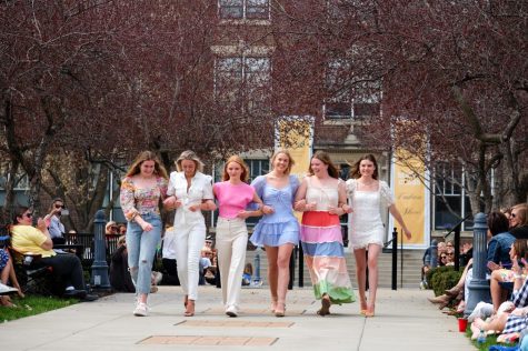 The first group of seniors strut down the runway April 3. This is the second year that the Mother-Daughter Tailgate and the Senior Fashion Show has been held in the quad. 