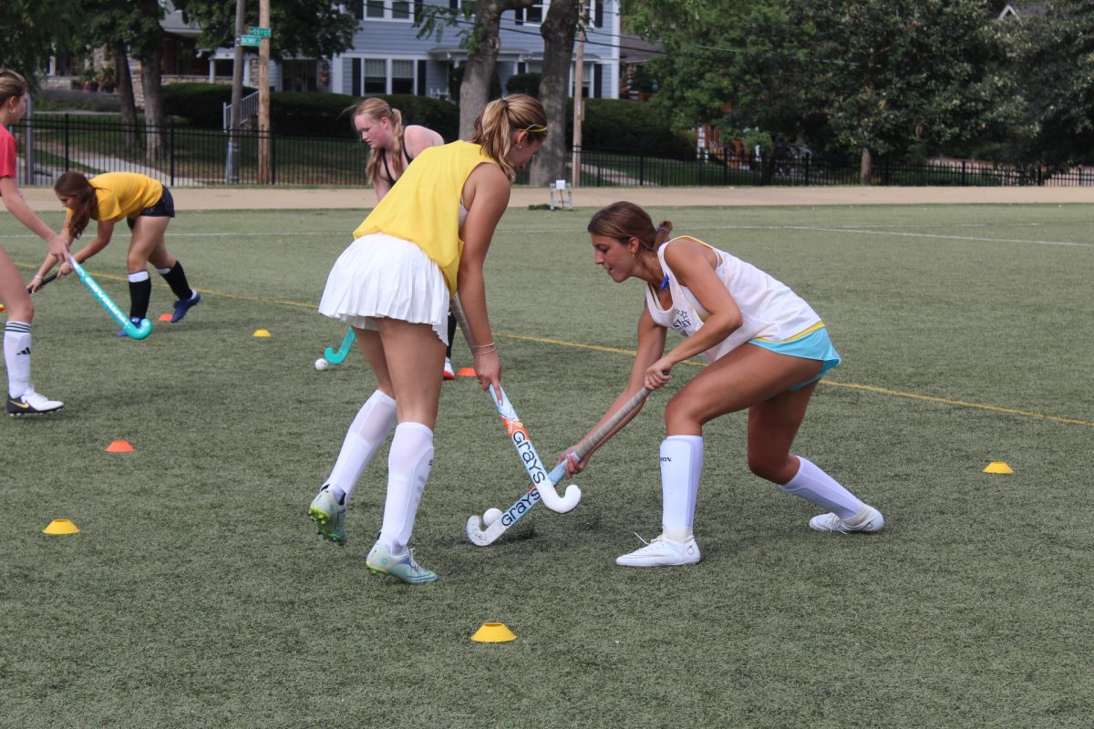 Seniors Leila Miquelon and Emma Garcia practice a drill.