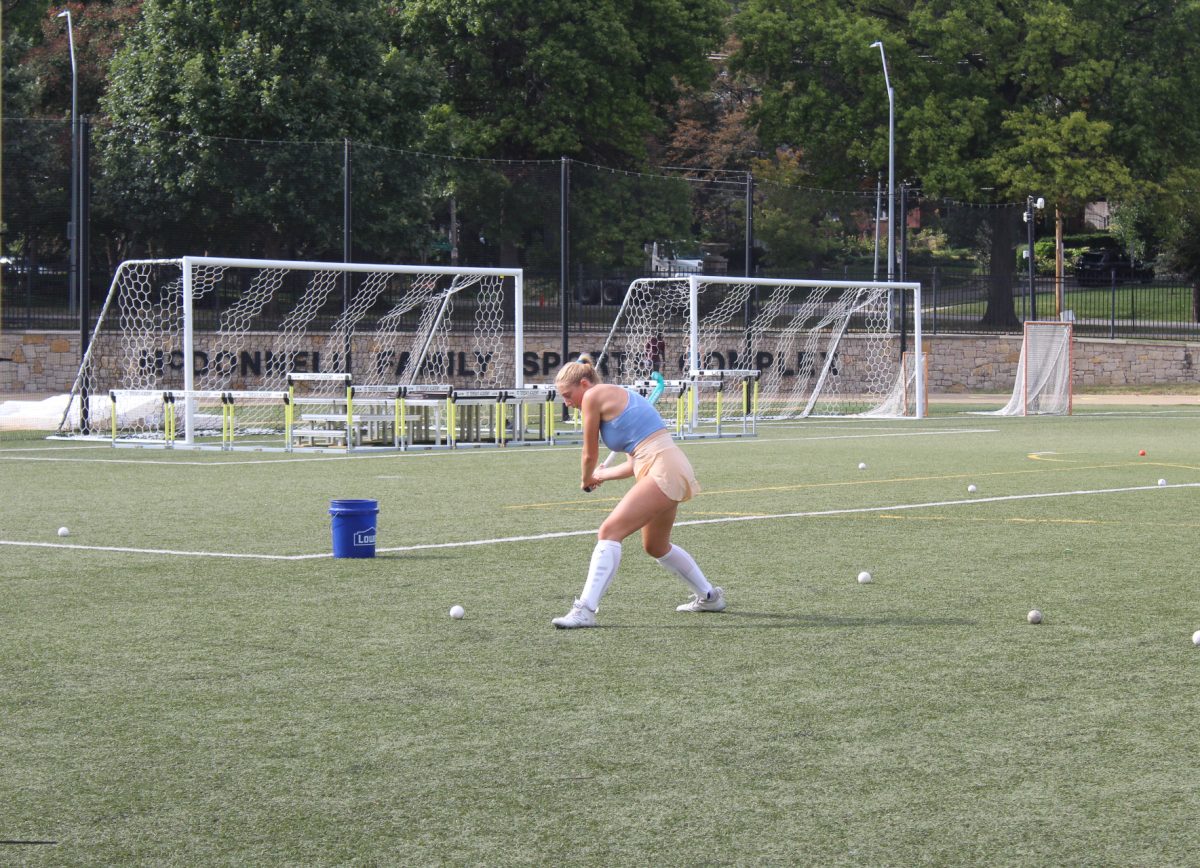 Senior Dossi Brender practices a shooting drill.